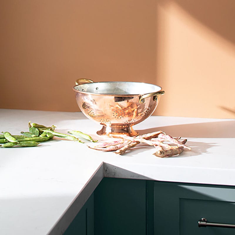 Benjamin Moore Color Trends 2021: Potter's Clay (1221), Kitchen Scene with Rose Gold Strainer on top of white countertop